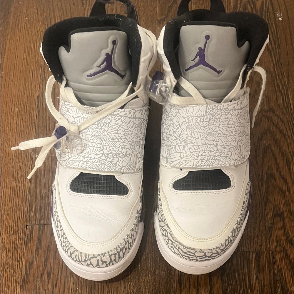 Jordan’s White and Gray Sneakers with Purple Accents